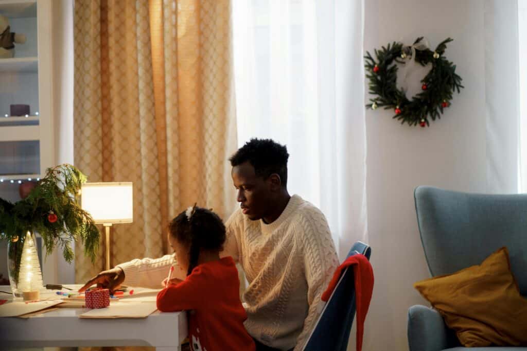 A father is teaching her daughter