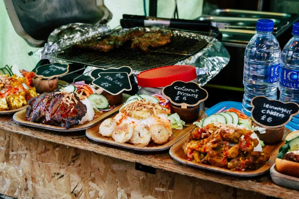 Cooked foods on a wooden tray in the market
