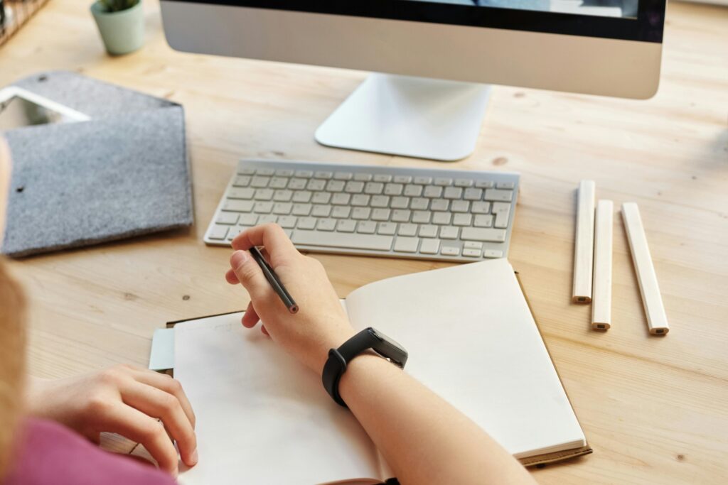 Cropped image of a student attending an online class