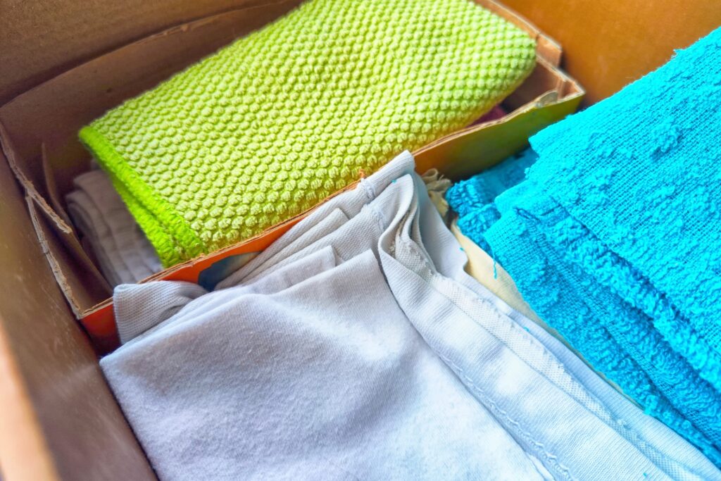 Repurposed cardboard boxes for keeping rags