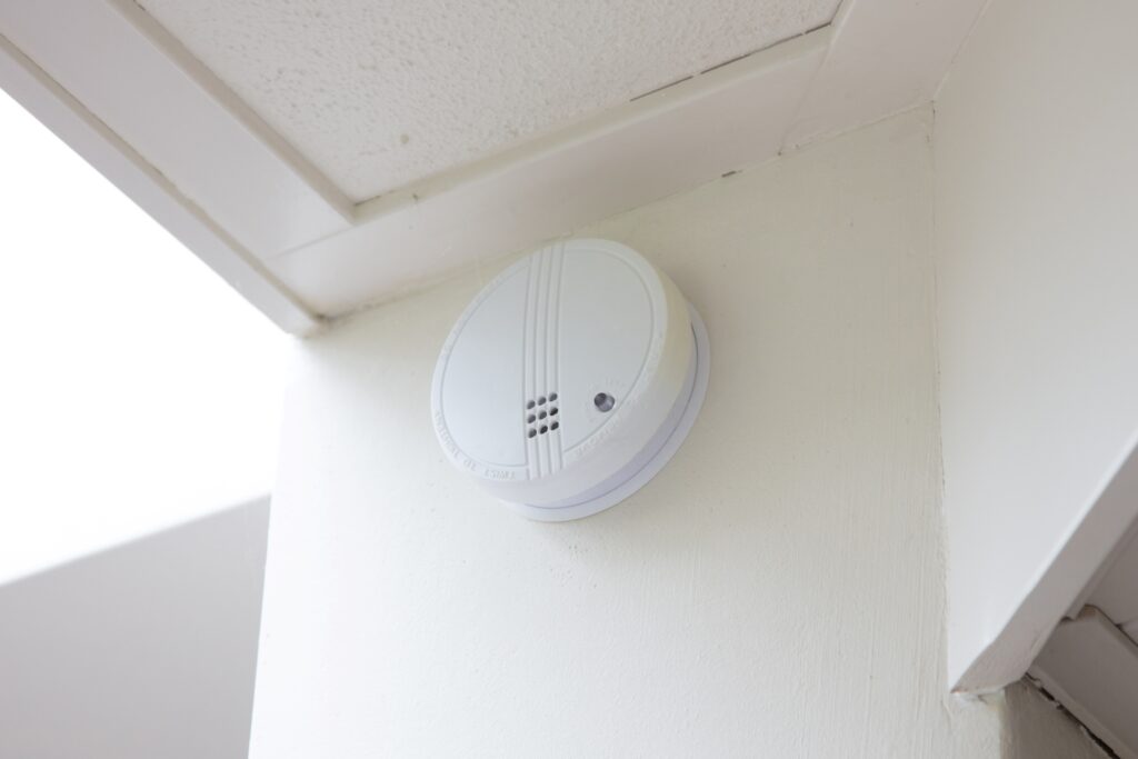 A smoke detector on the wall